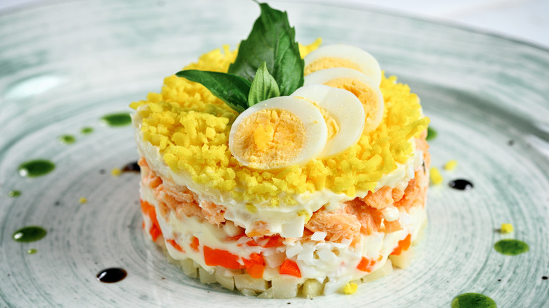 Mimosa salad featuring shaved egg topping