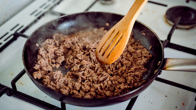 ground beef browning in a skillet