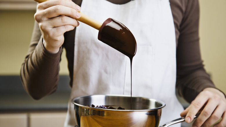 woman melting chocolate