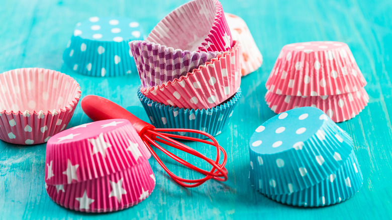 Colorful cupcake liners on a table 