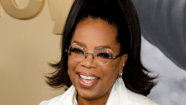 Oprah Winfrey smiling with glasses