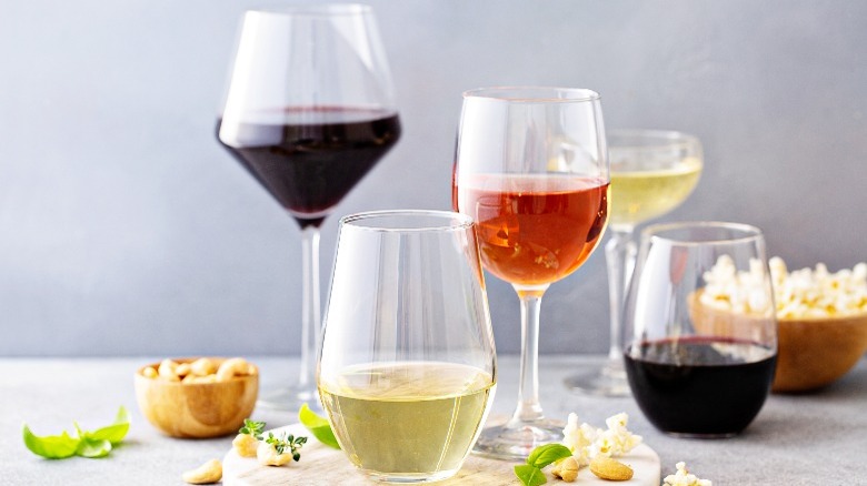 Different varieties of wine in variously shaped glasses