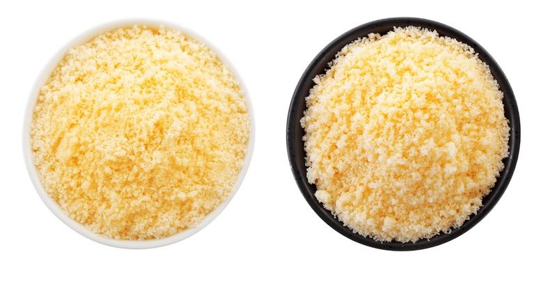 Two containers of pre-grated parmesan cheese