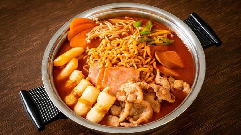 Budae jjigae with ramen, pork belly, rice cake, and vegetables