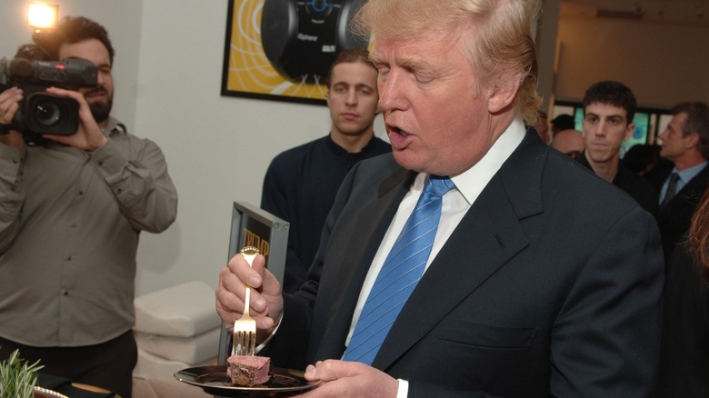 Donald Trump with his tiny piece of meat