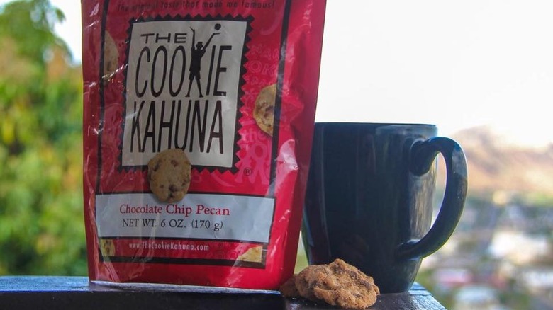A bag of The Cookie Kahuna next to a cup