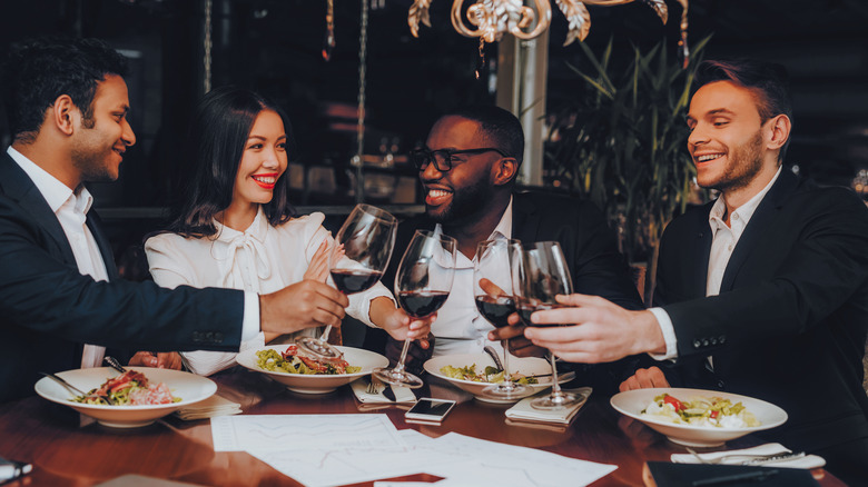 four people enjoying a meal