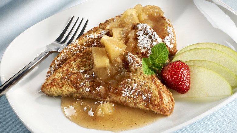 French toast on a plate topped with powdered sugar 