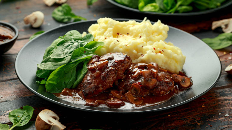 Salisbury steak with spinach and mashed potatoes
