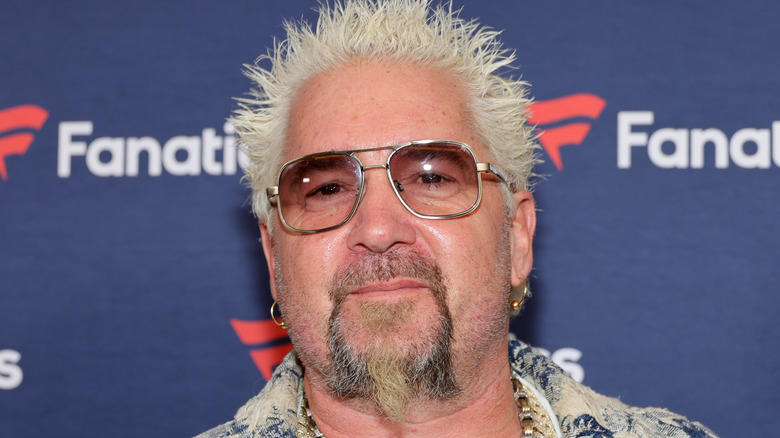 Guy Fieri smiling at an event