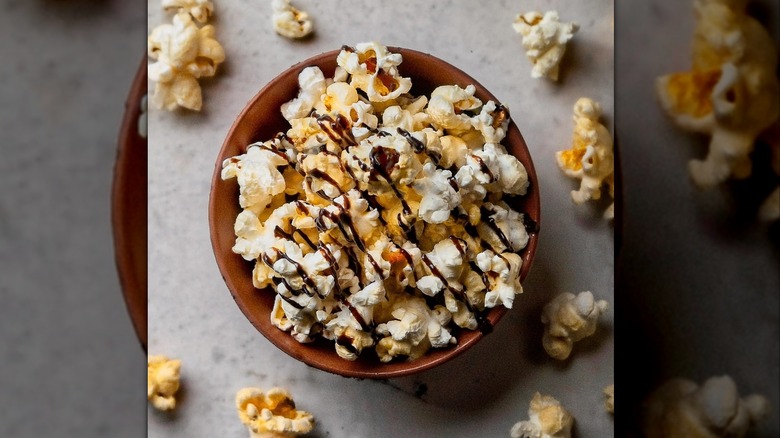 bowl of popcorn with chocolate drizzle