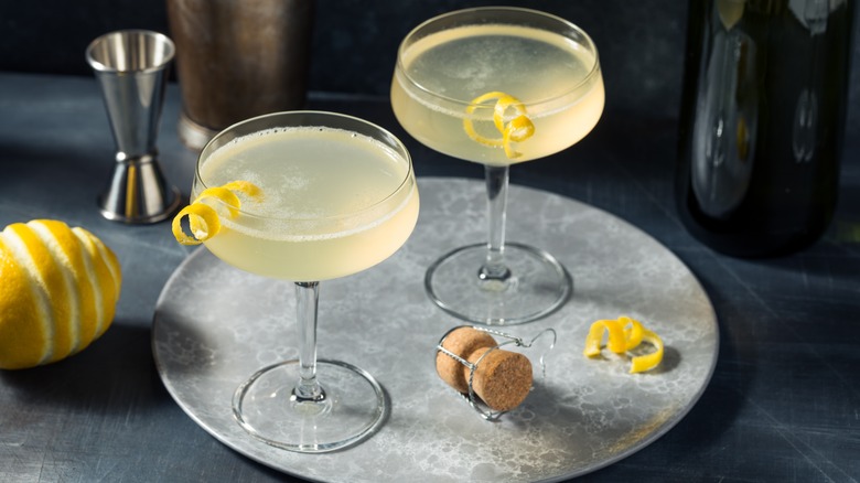 Two French 75 cocktails in coupe glasses