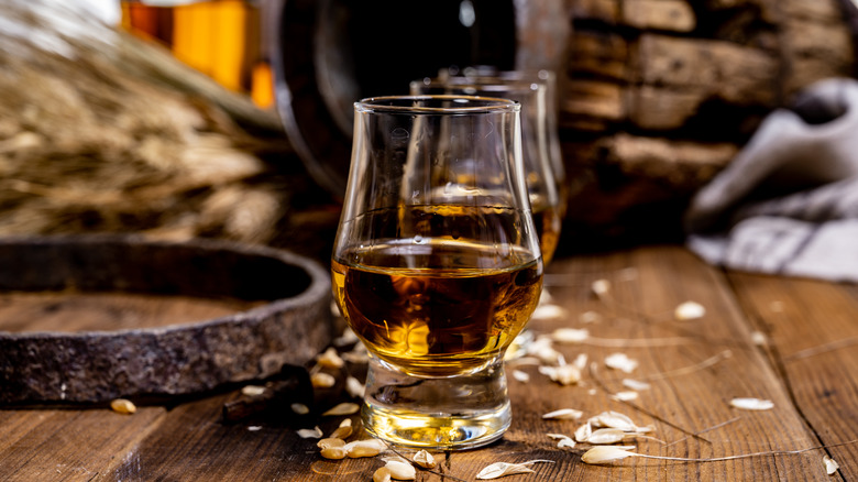 Glasses of Scotch with barley grains