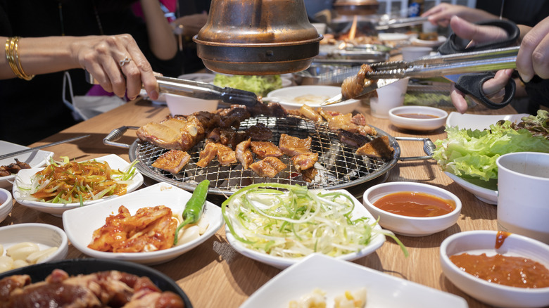 a spread of korean bbq and banchan