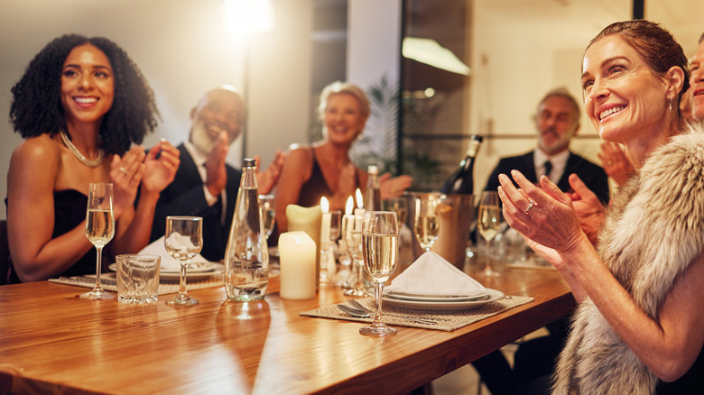 Guests at a formal dinner table