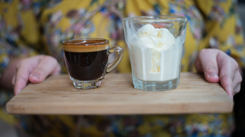 glass with ice cream and cup of espresso