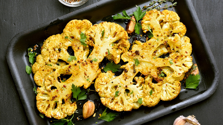 roasted cauliflower steaks in baking pan