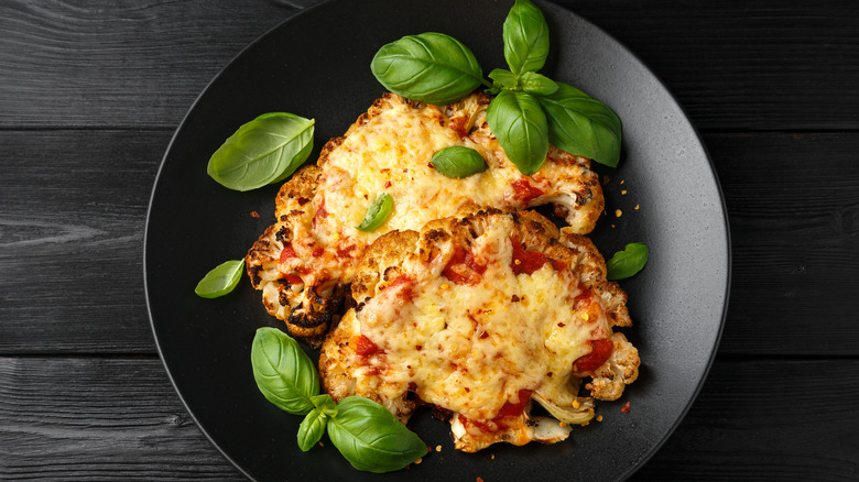 Cauliflower steak pizzas with basil