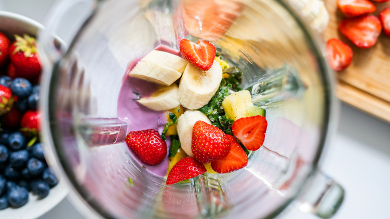 Chopped fruit inside a blender