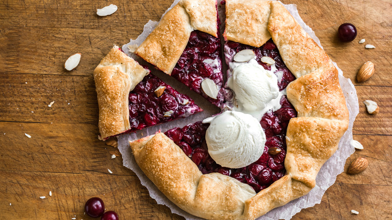 Cherry galette topped with vanilla ice cream