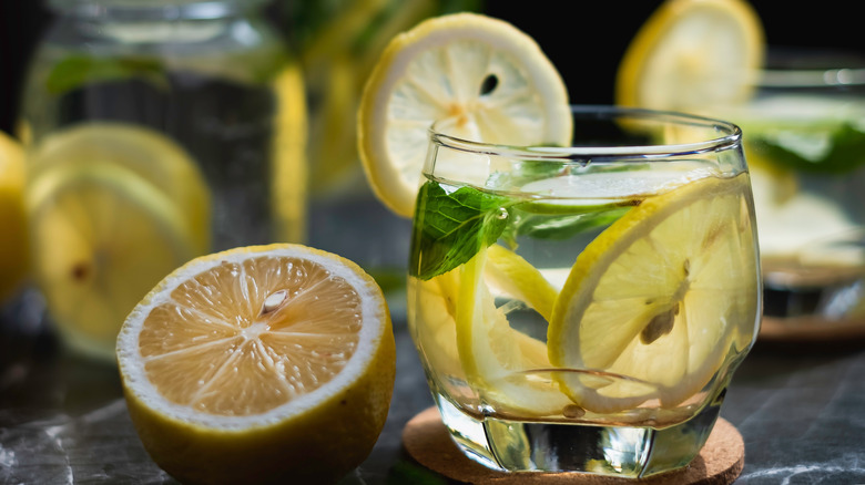 Infused water next to halved lemon