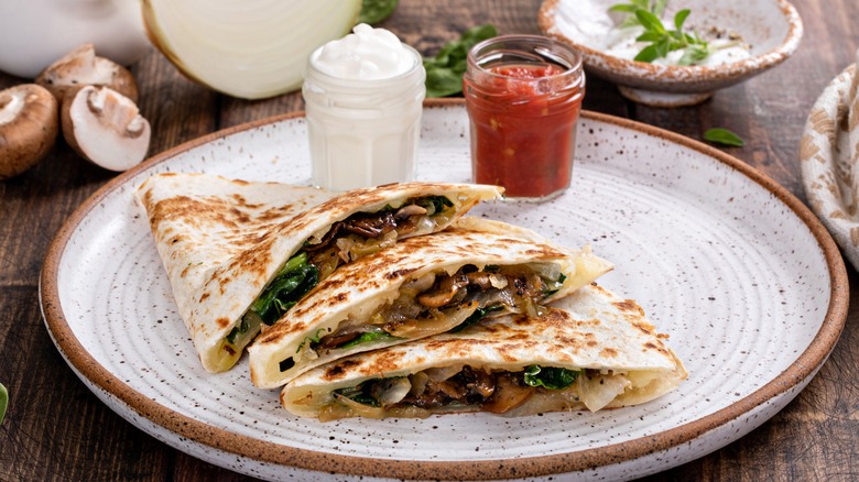 caramelized mushroom and onion quesadilla with salsa and sour cream