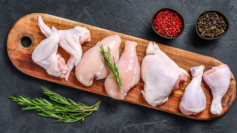 chicken pieces on a wooden board