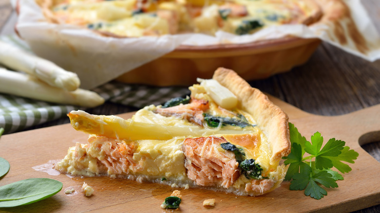 Quiche with salmon, spinach, and white asparagus