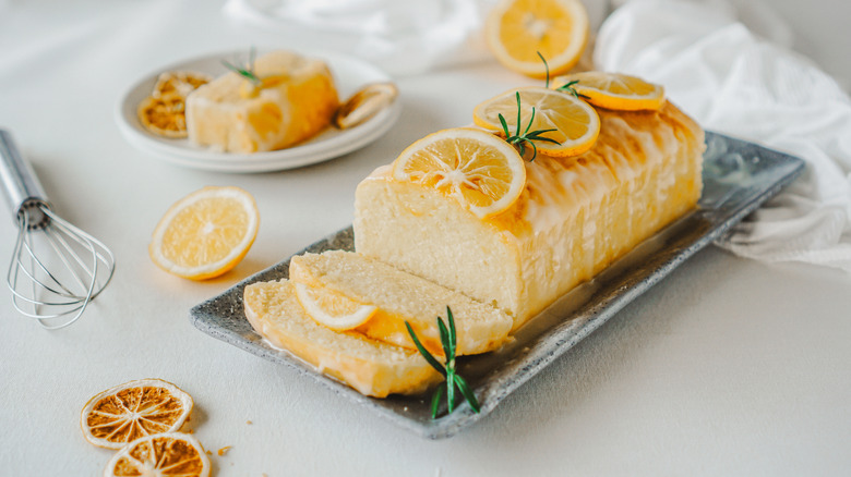 pound cake with citrus glaze with candied fruit and fresh rosemary