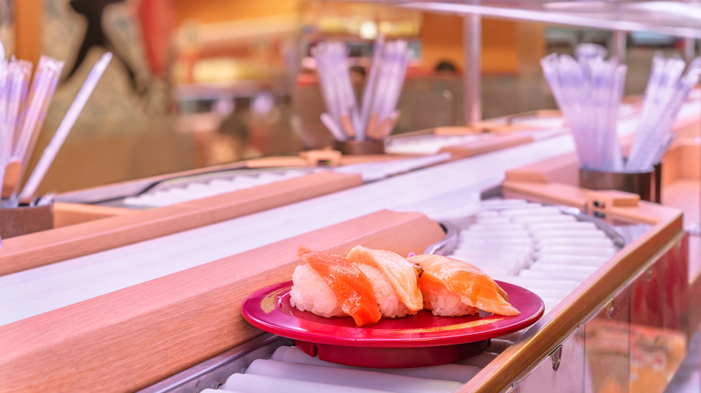 A plate of sushi on a conveyor belt