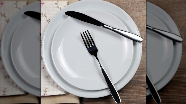 Fork and knife on plate at resting position