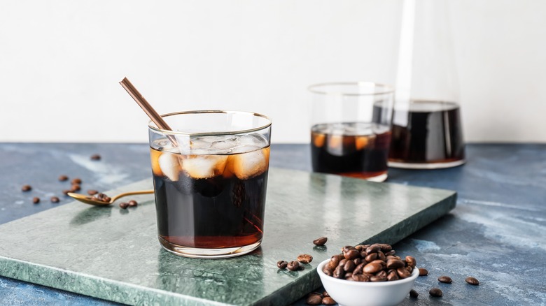 Cold brew coffee in cup with straw