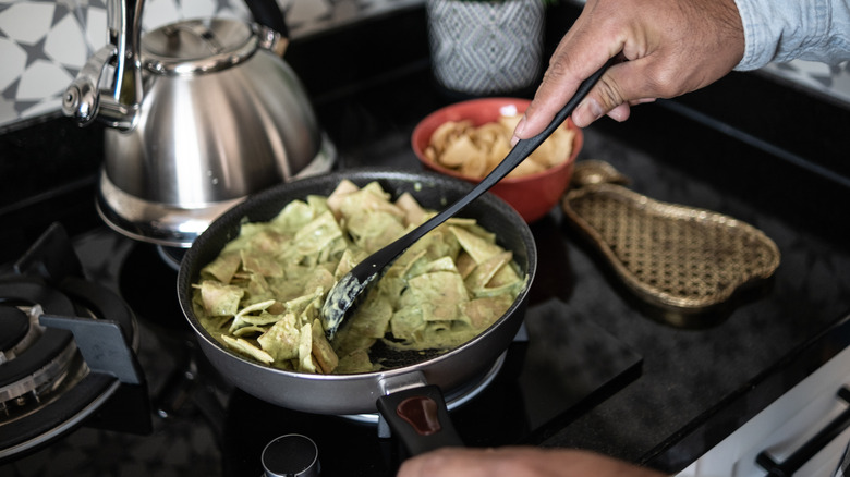 Making chilaquiles verdes on the stove