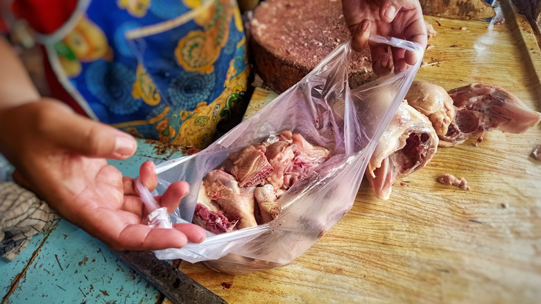 Various chicken parts in a plastic bag