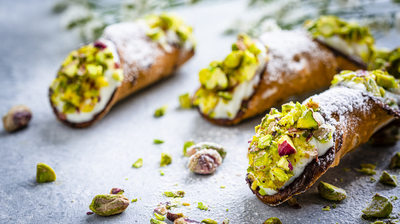 Ricotta filled cannolis with crushed pistachios