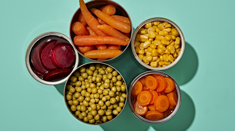 Top view of an assortment of canned vegetables