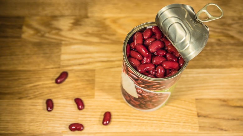 A can of red beans with lid opened