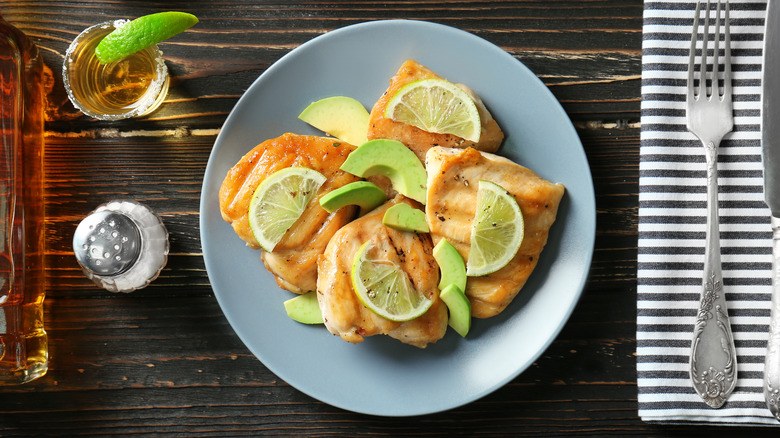 Plate of cooked tequila lime chicken with ingredients