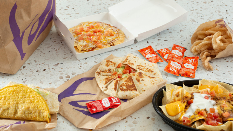 An array of food items from Taco Bell sprawled out on a table