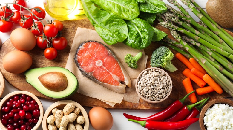 Various food ingredients, including vegetables and eggs, on a table