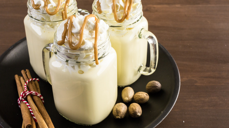 Frozen eggnog in mason jars with caramel drizzle