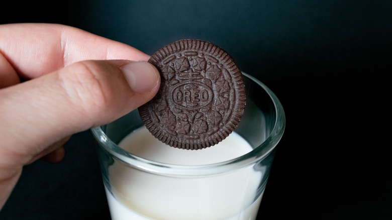 Oreo cookie dunked in milk