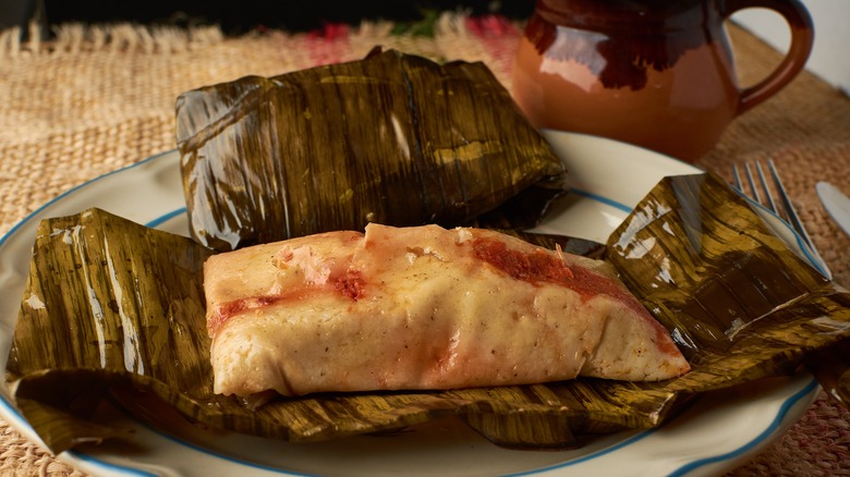 tamales wrapped in banana leaf