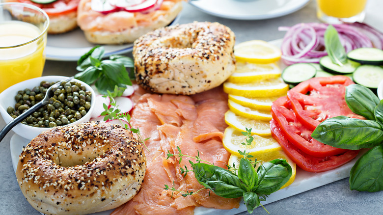 bagel board with lox, capers, tomatoes, red onion