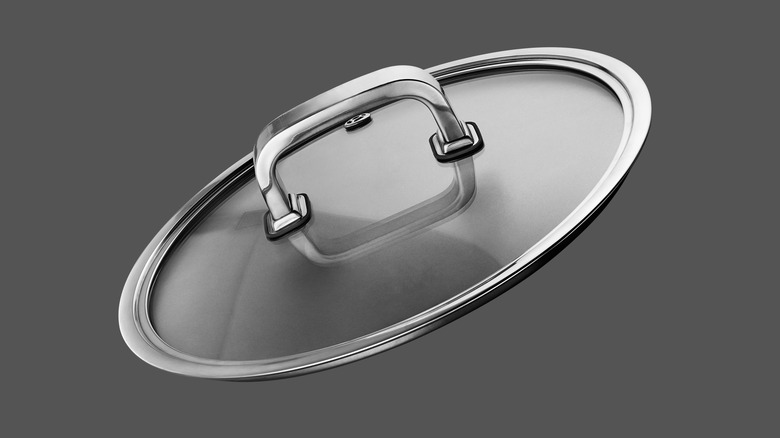 glass lid against gray background