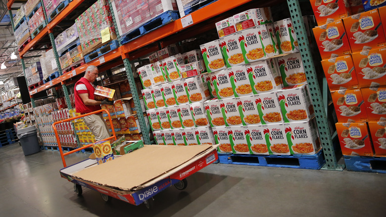 Employee stocking shelves at Costco