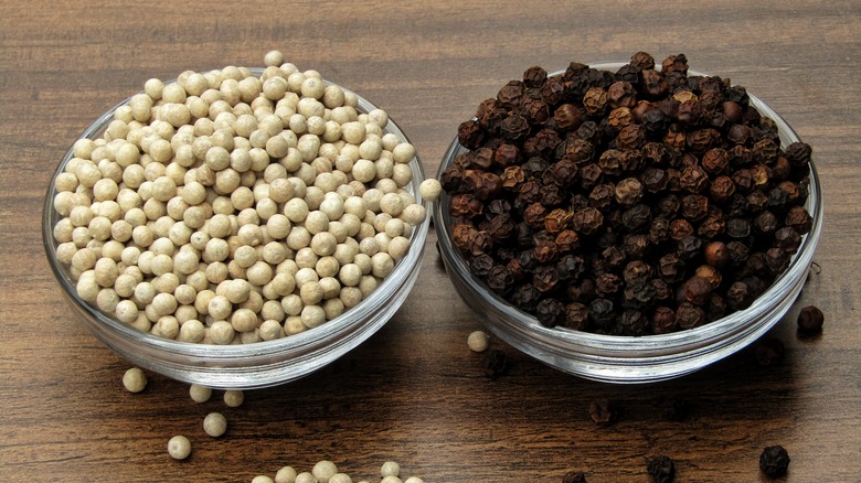 white and black whole peppercorns