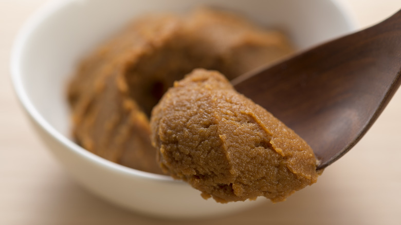 Close up of spoonful of miso paste