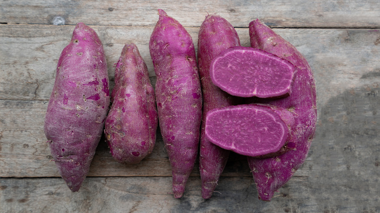 purple sweet potatoes on wooden surface