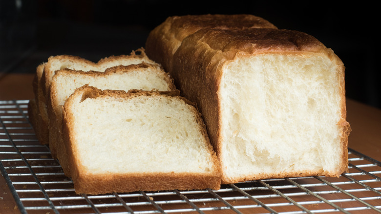 Homemade shokupan or Japanese milk bread sliced on a rack